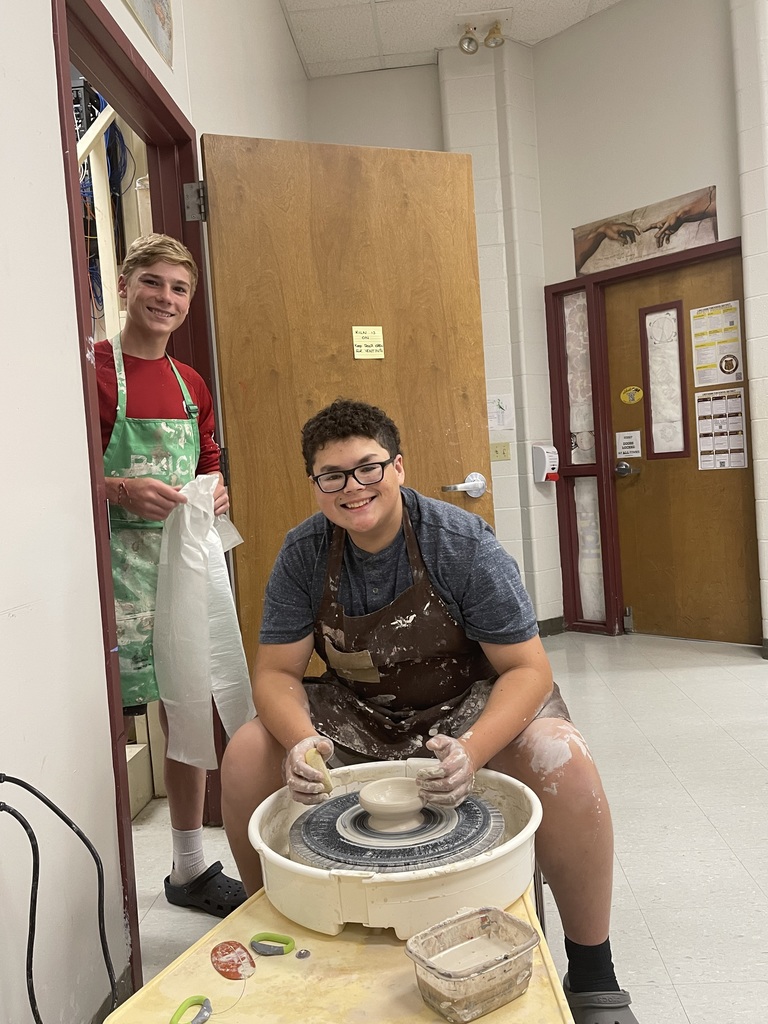 pottery wheel and students