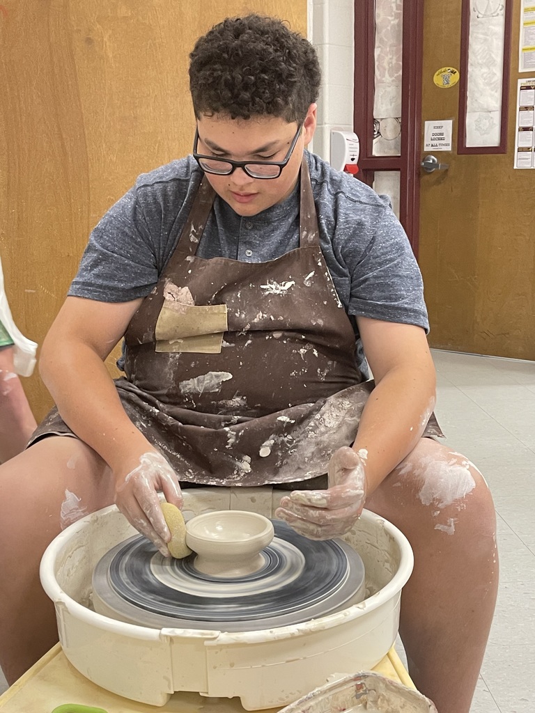 Pottery wheel and student